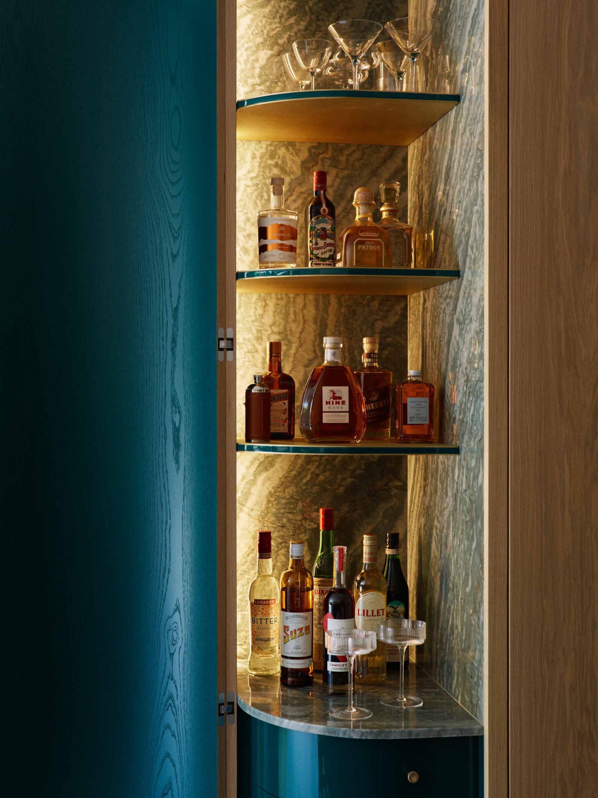 Lit drinks cabinet set into oak joinery