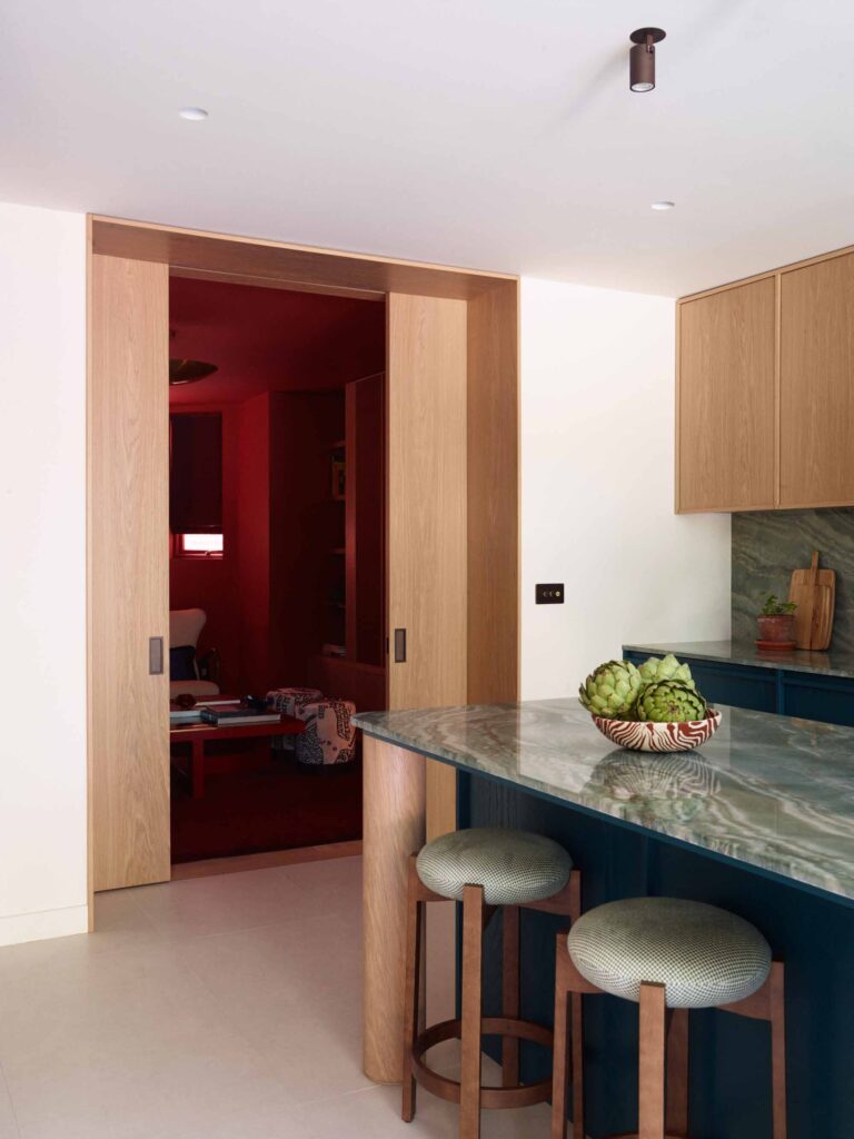 Kitchen island with a view through to the snug
