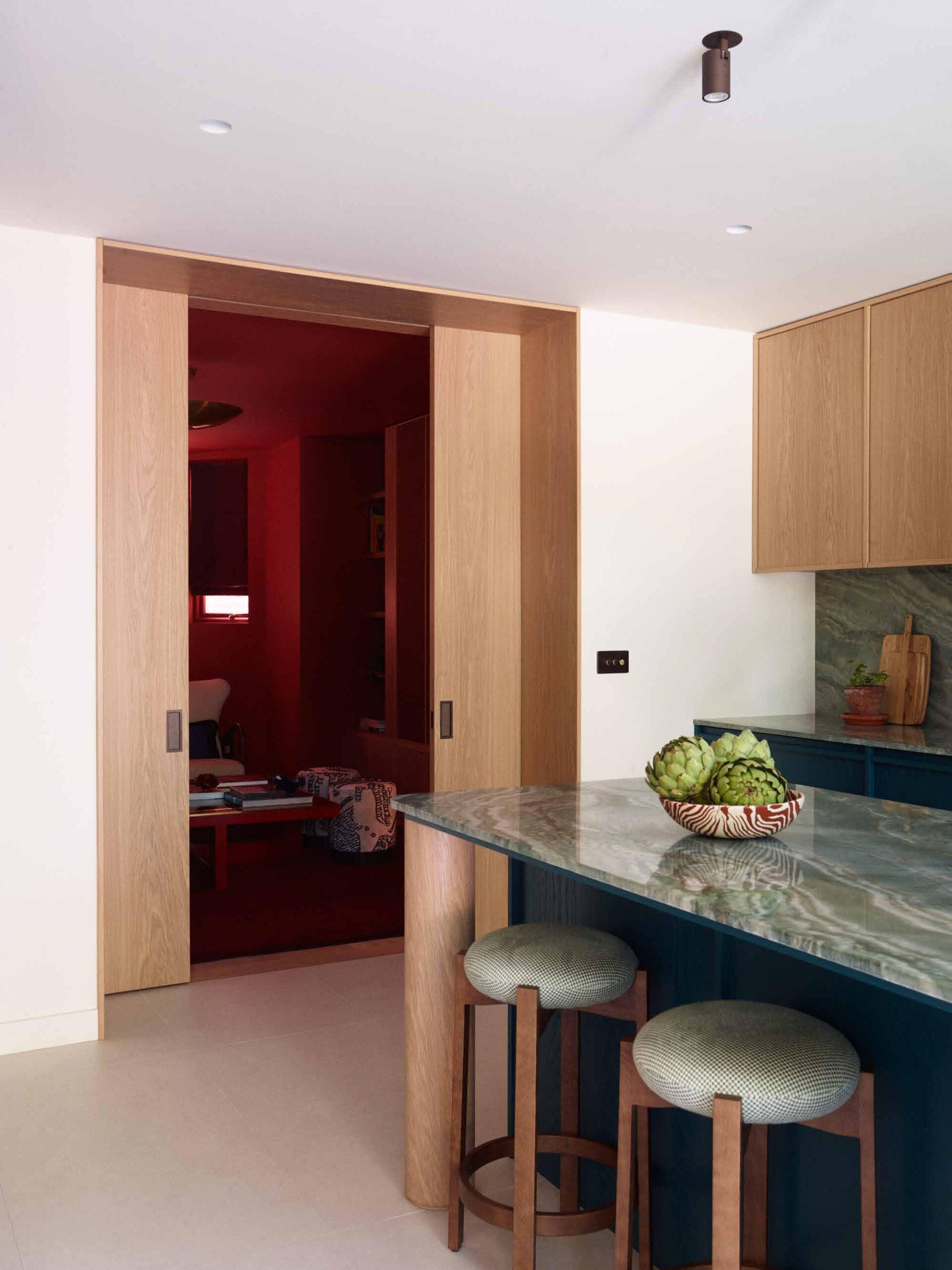 Kitchen island with a view through to the snug