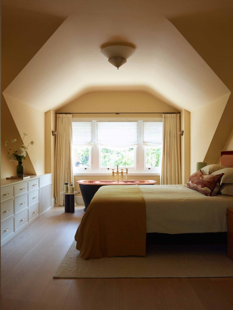 Main bedroom in the roof with copper bath