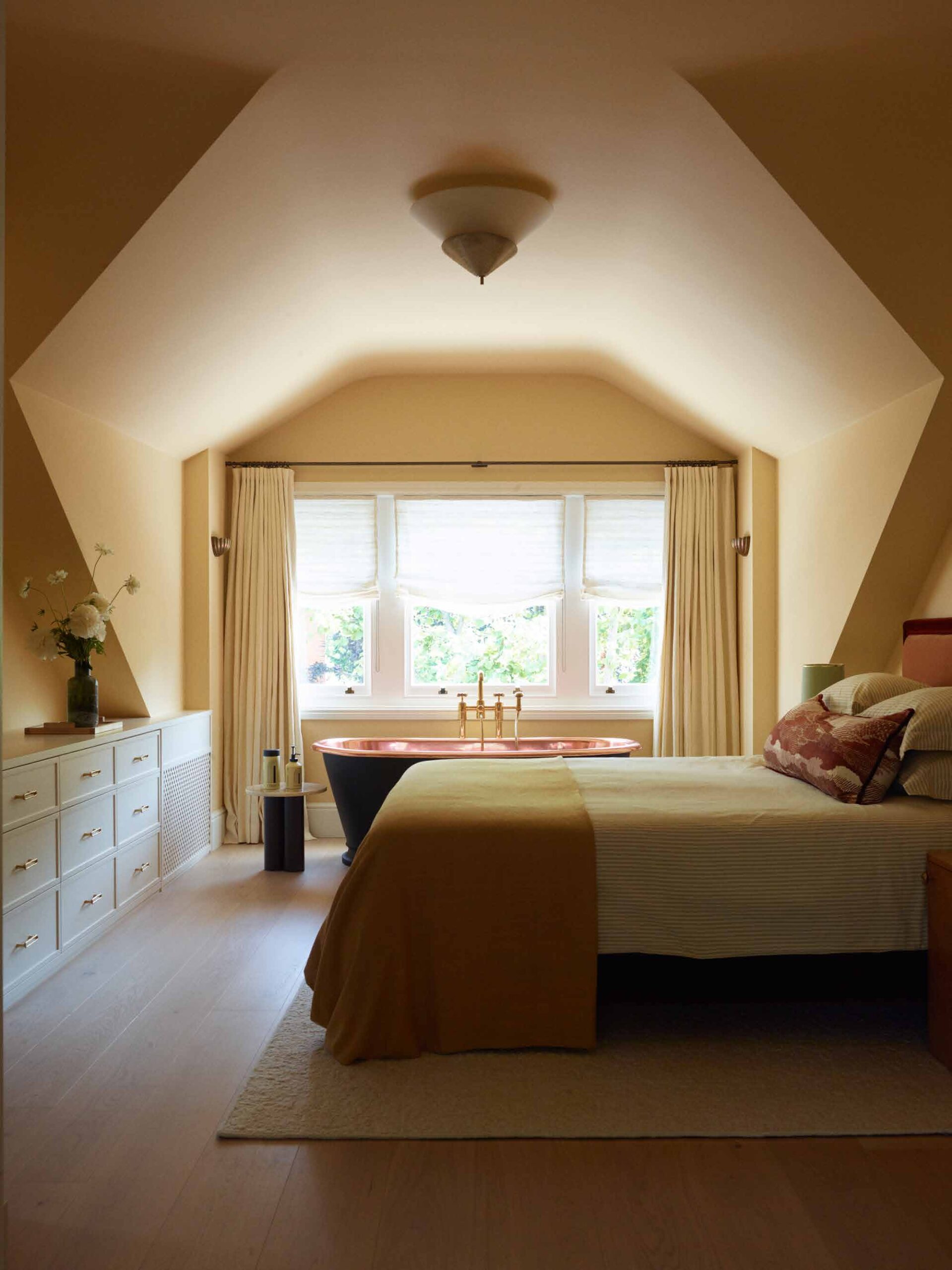 Main bedroom in the roof with copper bath